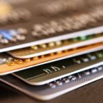 debt repayment in Canada — stack of credit cards representing personal debt