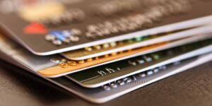 debt repayment in Canada — stack of credit cards representing personal debt