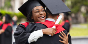 Student loan repayment in Canada concept showing graduates celebrating graduation before entering repayment phase