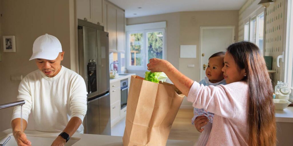 Your First 30 Days in Canada: A newcomer family settling into their new home.