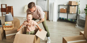 family moving into a new home in Canada, representing the hidden costs of buying a house