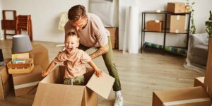 hidden costs of buying a home in Canada — homebuyers reviewing home purchase expenses and financial documents