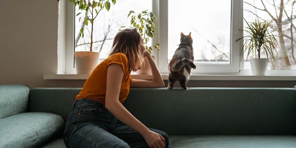 Present value concept illustration showing a person looking out a window while thinking about future financial decisions