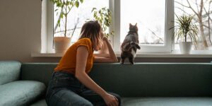 Present value concept illustration showing a person looking out a window while thinking about future financial decisions