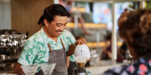 ways to improve cashflow in Canada — small business owner preparing coffee for customers
